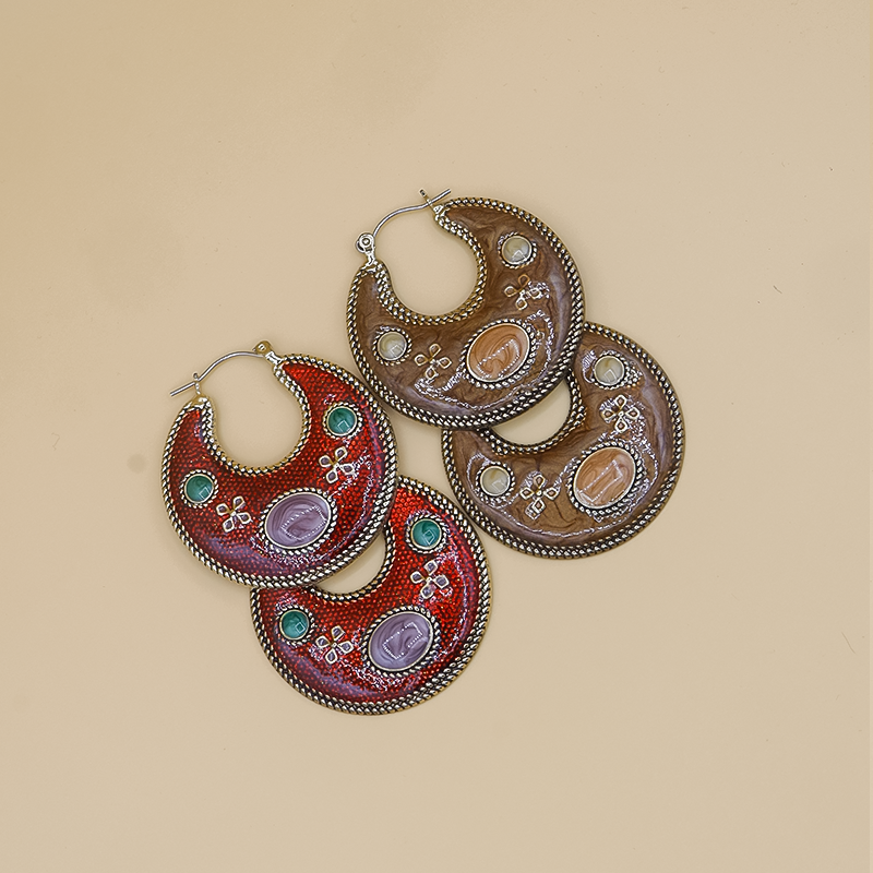 Vintage Hoop Earrings – Handcrafted hoop earrings with an intricately engraved centerpiece stone, fine beaded detailing, and a two-tone antique finish for a timeless look