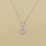 Radiant Halo Pendant Necklace – A gold-tone necklace with a round-cut center stone, surrounded by two halos of sparkling accents for an elegant and sophisticated look.